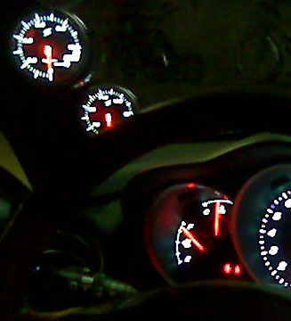 Oil pressure and temperature gauges VERY NICE integrated in the car. (sorry, do not have better picture at the moment...)